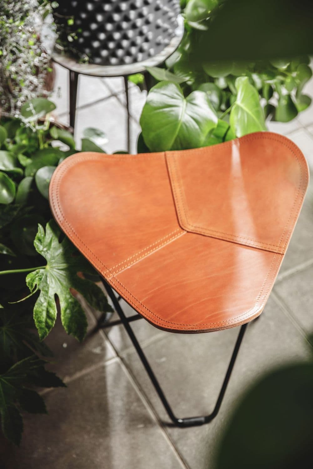 Flying Goose Ottoman in Leather by Cuero Design