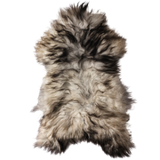 A grey, fluffy Icelandic sheepskin rug.
